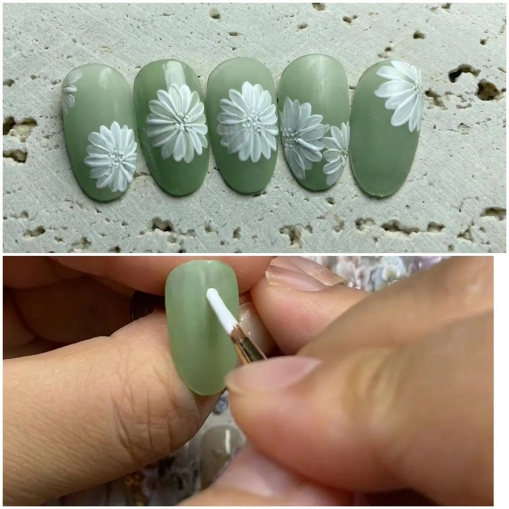 Primer plano de una uña siendo decorada donde un pincel delineador aplica un pequeño y preciso punto de esmalte en el centro de una margarita blanca.