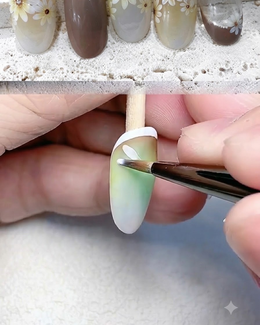 Un pincel delineador fino pintando pétalos blancos individuales para una flor de margarita en la uña.