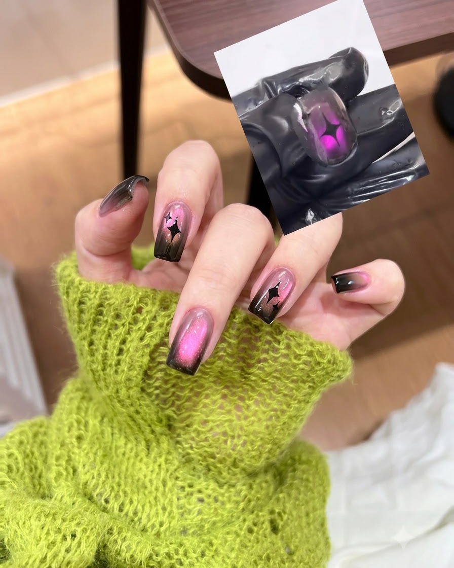 Una herramienta de imán cerniéndose sobre una uña cat eye rosa para mover las partículas magnéticas.